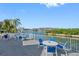 Enjoy waterfront views from this community patio with tables and chairs at 14880 Shipwatch Trce # 1915, Largo, FL 33774