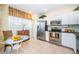 Kitchen with stainless steel appliances and breakfast nook at 14880 Shipwatch Trce # 1915, Largo, FL 33774