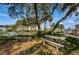 Relaxing outdoor space with picnic tables under shady trees at 14880 Shipwatch Trce # 1915, Largo, FL 33774