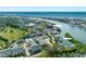 Aerial view showcasing community amenities including tennis courts, pool, and marina at 14880 Shipwatch Trce # 1915, Largo, FL 33774