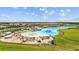 Aerial view of crystal lagoon with beach and surrounding amenities at 16565 Mosaic Oar Dr, Wimauma, FL 33598