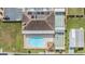Community overview showing pool, shuffleboard, and building at 37652 New Horizons Blvd, Zephyrhills, FL 33541