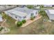An aerial view showcasing the home's exterior, landscaping, and location within the community at 37652 New Horizons Blvd, Zephyrhills, FL 33541