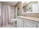 Bathroom with granite vanity and shower/tub combo at 37652 New Horizons Blvd, Zephyrhills, FL 33541