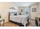 Bedroom with metal bed frame and wood flooring at 37652 New Horizons Blvd, Zephyrhills, FL 33541