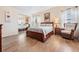 Bright bedroom with wood flooring and mirrored closet at 37652 New Horizons Blvd, Zephyrhills, FL 33541