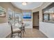 Cozy breakfast nook with glass table and window seating at 37652 New Horizons Blvd, Zephyrhills, FL 33541
