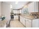 Kitchen with granite countertops and white cabinets at 37652 New Horizons Blvd, Zephyrhills, FL 33541