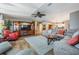 Living room with sectional sofa and hardwood floors at 37652 New Horizons Blvd, Zephyrhills, FL 33541
