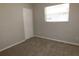 Simple bedroom with closet and neutral carpet at 4201 Dr Martin Luther King Jr N St, St Petersburg, FL 33703