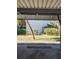 Covered carport with view of building and landscaping at 4632 Red Maple Rd # 1204, Bradenton, FL 34210