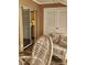 Relaxing patio with wicker furniture and view of kitchen at 4632 Red Maple Rd # 1204, Bradenton, FL 34210