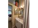 White vanity with a large mirror in a well lit bathroom at 4632 Red Maple Rd # 1204, Bradenton, FL 34210