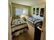 Guest bedroom with two twin-size beds and nightstands at 4632 Red Maple Rd # 1204, Bradenton, FL 34210