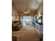 Living room with view of a screened patio and built-in shelving at 4632 Red Maple Rd # 1204, Bradenton, FL 34210