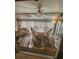 Sunroom with tiled floor, wicker furniture, and glass top table at 4632 Red Maple Rd # 1204, Bradenton, FL 34210