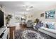 Bright living room with hardwood floors, comfortable furniture, and kitchen views at 4715 Bay Ne St # 223, St Petersburg, FL 33703