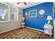 Spacious bedroom with blue accent wall and decorative elements at 4715 Bay Ne St # 223, St Petersburg, FL 33703