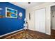 Relaxing bedroom with blue accent wall, area rug, and window at 4715 Bay Ne St # 223, St Petersburg, FL 33703
