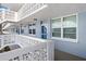 Exterior view of a condo building with a walkway and blue building at 4715 Bay Ne St # 223, St Petersburg, FL 33703