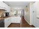 Modern kitchen with white cabinets, granite countertops, and stainless steel appliances at 4715 Bay Ne St # 223, St Petersburg, FL 33703