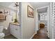 Bathroom with granite countertop, white cabinets, and tiled floors at 4715 Bay Ne St # 223, St Petersburg, FL 33703