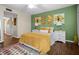 Bedroom with green accent wall and wood floors at 4715 Bay Ne St # 223, St Petersburg, FL 33703