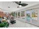 Bright sunroom with pool view and ceiling fan at 4801 Dartmouth N Ave, St Petersburg, FL 33713