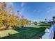 Backyard with a pond view and a white picket fence at 508 Canal Way, Oldsmar, FL 34677