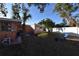 Side yard with shed, kayaks, and seating at 552 Trade Winds Dr, Dunedin, FL 34698