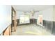 This dining room is missing drywall and shows window views at 552 Trade Winds Dr, Dunedin, FL 34698