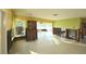 A living room with no drywall or flooring is visible in this image at 552 Trade Winds Dr, Dunedin, FL 34698