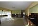 A living room with bare studs and a bar is shown in this image at 552 Trade Winds Dr, Dunedin, FL 34698