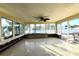 This spacious sunroom features glass windows and lots of light at 552 Trade Winds Dr, Dunedin, FL 34698