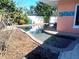 Relaxing kidney-shaped pool with a spa, perfect for outdoor enjoyment at 552 Trade Winds Dr, Dunedin, FL 34698