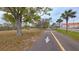 Neighborhood walking path for scenic strolls and convenient access to local amenities at 552 Trade Winds Dr, Dunedin, FL 34698