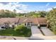 Well-maintained home with lush landscaping, a neatly manicured lawn, and a spacious two-car garage at 5935 Precious View Ct, New Port Richey, FL 34655