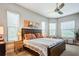 Spacious bedroom with large windows and ceiling fan at 8191 Gabanna Dr, Sarasota, FL 34231