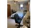 Spacious bedroom with a queen-size bed and built-in shelving at 8906 Windsong Ln, Port Richey, FL 34668