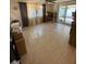 Bright living room with tile floors and plenty of natural light at 8906 Windsong Ln, Port Richey, FL 34668
