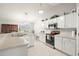 Spacious kitchen with stainless steel appliances and ample counter space at 10306 Chatuge Dr, San Antonio, FL 33576