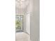 Clean hallway with neutral walls and tiled floor at 10306 Chatuge Dr, San Antonio, FL 33576