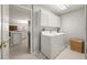 Laundry room with washer, dryer, and cabinets at 10306 Chatuge Dr, San Antonio, FL 33576