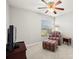 Cozy bedroom with ceiling fan and large window at 10306 Chatuge Dr, San Antonio, FL 33576