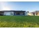 Backyard with covered patio and lush lawn at 10306 Chatuge Dr, San Antonio, FL 33576