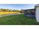 Backyard with screened patio and pond view at 10306 Chatuge Dr, San Antonio, FL 33576
