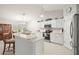 Open kitchen boasting stainless steel appliances and a breakfast bar at 10306 Chatuge Dr, San Antonio, FL 33576