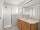 Clean bathroom with shower, vanity, and mirror at 10306 Chatuge Dr, San Antonio, FL 33576