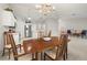 Open dining area with chandelier and view of kitchen at 10306 Chatuge Dr, San Antonio, FL 33576