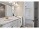 Double vanity bathroom with access to another bedroom at 10551 Tranquil Meadow Loop, Riverview, FL 33569
